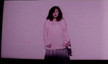 Aki steps out from behind the camera.