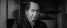 Minokichi delivers a grave warning.